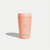 Hedoniq peach reusable travel cup with minimalist coffee branch design.