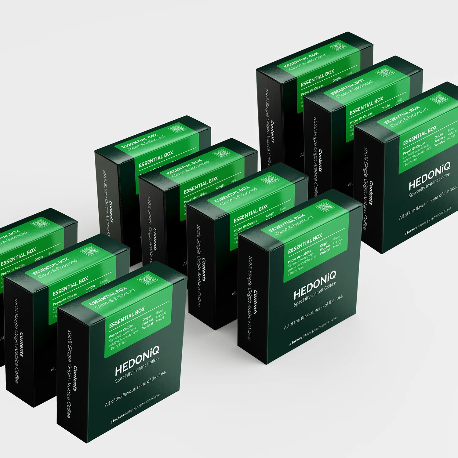 Ten boxes of Hedoniq Essential Box specialty instant coffee, neatly displayed in rows on a light background.